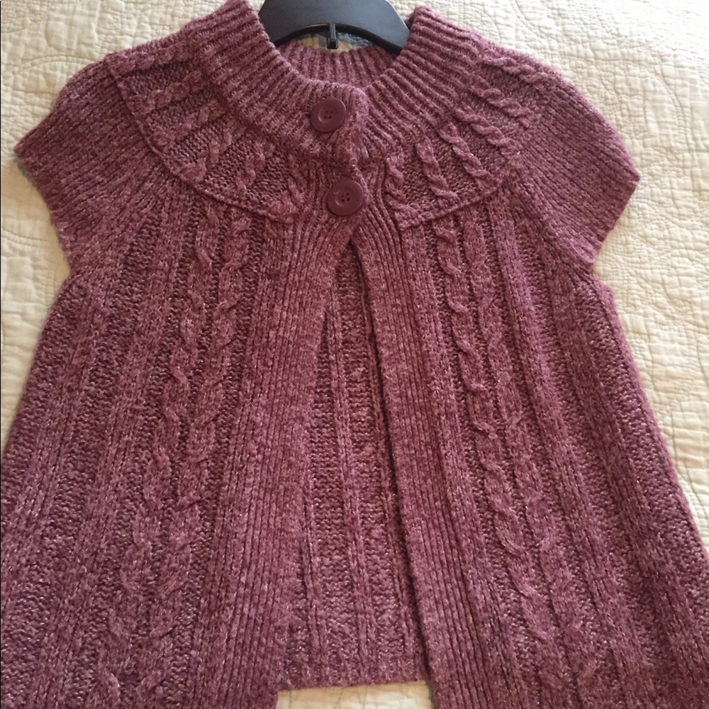 Pinkish purple sweater vest.